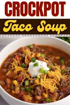 a white bowl filled with taco soup and topped with sour cream