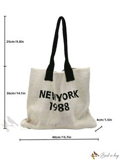 the new york tote bag is shown in black and white with measurements for it