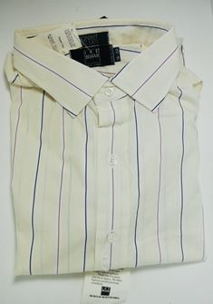 Vintage Ike Behar shirt made for Bonwit Teller, pale cream yellow, with purple pinstripes, 100% cotton, never worn. Beige Formal Shirt For Summer, Beige Formal Summer Shirt, Formal Summer Tops With Vertical Stripes, Formal Summer Top With Vertical Stripes, Summer Formal Tops With Vertical Stripes, Formal Pinstripe Shirt For Summer, Formal Summer Pinstripe Shirt, Summer Formal Pinstripe Shirt, Cream Spread Collar Shirt For Spring