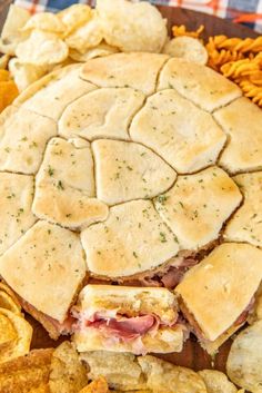 brown sugar and ham rolls on a platter with chips in the foreground text reads brown sugar and ham rolls