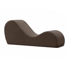 a brown chair that is sitting on the side of a white wall and it's curved