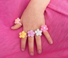 Pastel Flower Ring perfect for toddler and little girls. These little rings are a fun, affordable gift for kids, and add a pop of fun to any spring outfit.  This is for toddler and little kids, and too small for adults. It is not recommended for children under 3 years old, as it can pose as a choking hazard. The ring measures 14mm in diameter, or a size 3. Ideal for children age 3-6. MATERIALS USED -Approximately 18mm resin flower in pink, yellow, blue, purple, or light pink. -Pink plastic ring base Kid Ring, Hot Pink Jewelry, Silver Baby Bracelet, Ring Kids, Toddler Jewelry, Newborn Baby Girl Gifts, Girl Ring, Toddler Bracelet