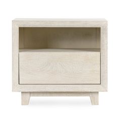 the side table is made from white wood and has an open shelf on one end