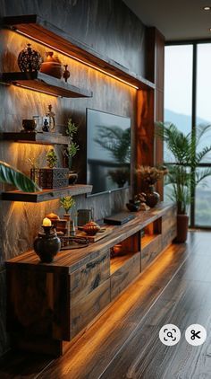 a living room filled with furniture and a flat screen tv on top of a wooden shelf