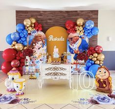 an image of a birthday party setting with balloons and decorations on the floor in front of it