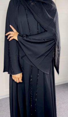 A stunning and luxurious umbrella style abaya featuring beadwork and embellishments on the abaya. Made with premium nida fabric. Comes with buttons down the center so can be worn open or closed. Perfect for special occasions. Comes with: - Outer abaya - Hijab - Belt Colour may vary due to device settings. Check size guide before placing order. Dry clean only. Beaded Abaya, Batwing Abaya, Ramadan Abaya, Wedding Abaya, Satin Abaya, Habits Musulmans, Abaya Hijab, Fashion Umbrella, Eid Ramadan