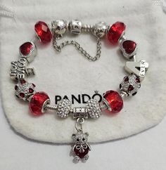 AUTHENTIC Pandora Barrel Clasp Bracelet  These are purchased from Pandora and come with a receipt. While I use high quality beads and charms on the Pandora bracelet,  the charms and beads used on the bracelet are NOT Pandora Brand, making the bracelet very affordable.   Beads and charms include: Red single core diamond faceted beads, Heart Bead, I love you bead, silver plated Red Hearts bead, silver plated red crystal heart Bear charm, 4ever bead   Pandora Bracelet Shown is  7.9 with barrel clasp Also available Gona 7.7 SS White Gold Plated Toggle Clasp Includes  security bead and Clasp Bead                   Gift box and ships USPS Priority Mail Per Pandora  Make your jewelry the last thing you put on in the morning and first thing you take off at night. High & Dry Remove jewelry prior to Red Pandora Bracelet, Bracelets Colors, Simplistic Jewelry, Pandora Bracelet Charms Ideas, Pandora Red, Night High, Crystal Bead Jewelry, Pandora Rings, Clasp Bracelet