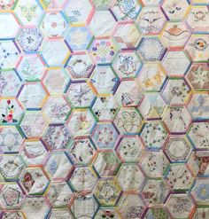 a quilt made up of hexagons and flowers