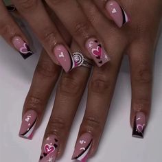 a woman's nails with hearts and stars on them