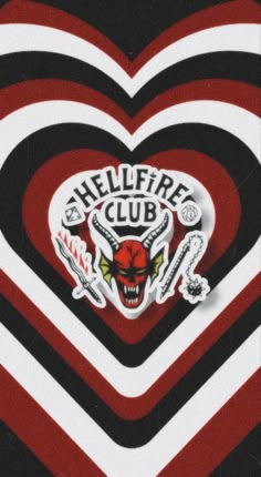 a heart with an image of a demon on it and the words hellfire club