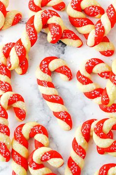 red and white pretzels are arranged on a marble surface