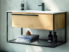 a bathroom with a sink, mirror and towel rack on the wall next to it