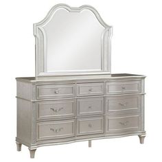 a white dresser with a mirror on top and drawers in front of it, against a white background