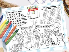 an activity book with cartoon characters on it and some crayons next to it