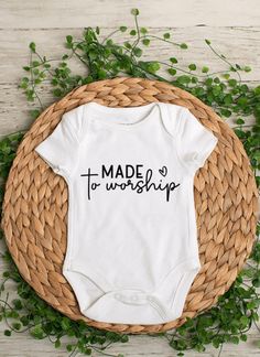 Made to Worship baby bodysuit or toddler t-shirt - This is a perfect baby shower gift *Bodysuits are Carter's brand. Please see their sizing chart if you aren't sure what size to order. *All bodysuits are white. The color you choose is for the text/image.  *If you would like a colored bodysuit, please request a custom order and we can see if we can meet your needs. Please note though that there is usually an added charge for this. *Each design is professionally cut and heat pressed to the bodysu Cotton Onesie For Baptism, Family Matching Short Sleeve Bodysuit For First Birthday, Cotton Baptism Onesie With Short Sleeves, White Short Sleeve Onesie For Mother's Day, Cotton Short Sleeve Onesie For First Birthday, White Short Sleeve Onesie For Baptism, Unisex Short Sleeve Onesie For First Birthday, Short Sleeve Onesie For First Birthday, Cute Cotton Onesie For Baptism