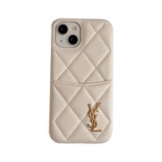 a white phone case with a gold saint laurent logo on it