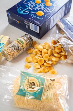 the ingredients for this meal are laid out on top of the white countertop, including corn flakes and cheese