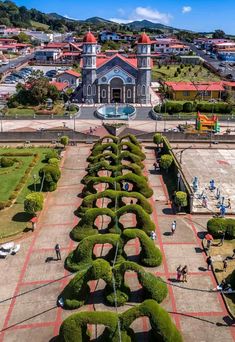 an aerial view of a church and gardens