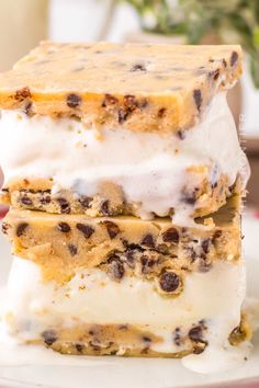 three pieces of ice cream and chocolate chip cookie bars stacked on top of each other