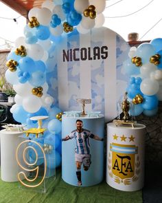 an image of a man on the field with balloons and decorations in front of him