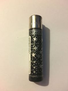 a black and silver lighter with stars on it