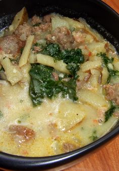 pasta with meat and vegetables cooking in a pot