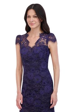 a woman wearing a purple lace dress