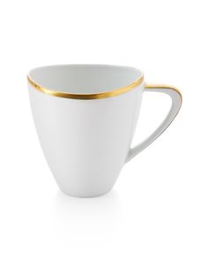 a white coffee cup with gold trim on the rim and bottom, sitting in front of a white background