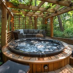 a large hot tub sitting in the middle of a wooden decked area with seating