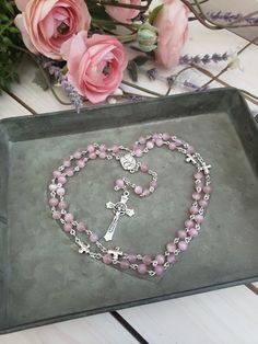 "Beautifully made chain link rosary, approximately 17\" long. Beads are 6mm Pink cats eye glass, Stations are 1/2\" Silver finish Crosses. Centerpiece is a silver 1/2\" Holy Family/Holy Spirit medal, and Crucifix is a 1.5\" St. Benedict cross. **Confirmation and First Holy Communion alternate centerpieces available at NO extra cost ---Centerpieces options: 1. Guardian angel/Pray for us 2. Holy Spirit/Pray for us 3. Miraculous medal 1\" oval 4. St Benedict medal 5. Rose/Lady of Grace 6. Fancy mir Pink Rosary, St Benedict Cross, St Benedict Medal, Benedict Medal, St Benedict, Rosary Beads Catholic, Catholic Rosary, Baptism Girl, Eye Glass