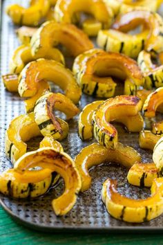 grilled squash on a baking sheet ready to be cooked in the oven for dinner