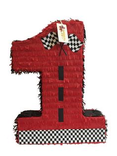 the number one made out of red material with black and white checkers on it