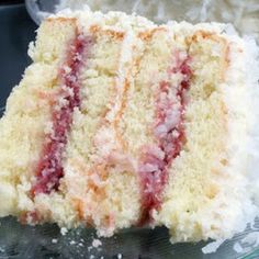 a slice of cake sitting on top of a glass plate next to another piece of cake