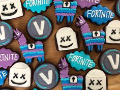 decorated cookies with the letters v and two llamas on them are arranged next to each other