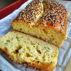 two loaves of bread with sesame seeds on top