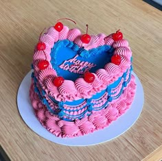 a heart shaped cake on a wooden table