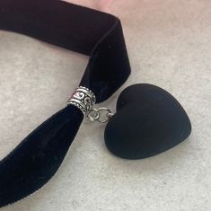 Heart pendant, with a matt look and feel, on a bail with 16mm wide black velvet. Select length of actual choker upon purchasing, which then comes with an additional 5cm extender. Great addition to any outfit. I am also selling this design with ribbon ties instead of a clasp, please check all my choker designs. Also I am sellying this small heart as a necklace, if you are interested please check out my necklace range. Y2k Emo Grunge, Choker Black, Choker Designs, Black Velvet Choker, Y2k Emo, Pendant Choker, Emo Grunge, Velvet Choker, Black Choker