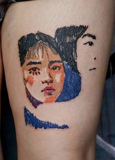 a woman's thigh with a drawing of two people on it