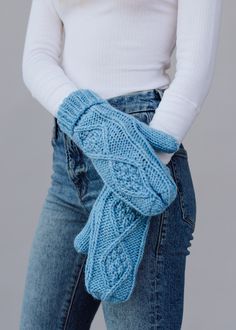 These light blue mittens offer a stylish way to stay warm in the colder months. They feature a fleece lining and pair with a matching pom hat. Keep your hands toasty in the fall and winter months with these comfy mittens. Light blue cable knit mittens Fleece lined One size Designed in the U.S.A. Produced in China. 100% Acrylic Matching pom hats available Cable Knit Mittens, Blue Mittens, Women's Mittens, Thrift Inspo, Knitted Hats Kids, Knit Hat For Men, Knit Jewelry, Winter Mittens, Matching Hat