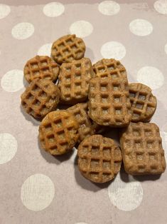 several small waffles sitting on top of a polka dot table cloth