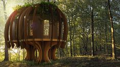 a tree house in the middle of a forest with lots of trees growing out of it