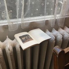 an open book sitting on top of a radiator