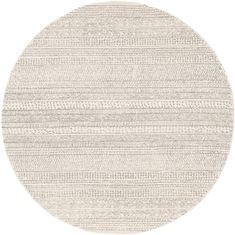 a round rug with white and grey stripes