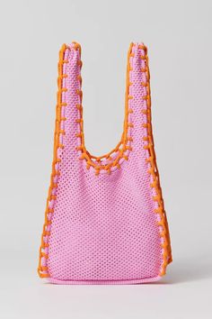 an orange and pink handbag on a white background