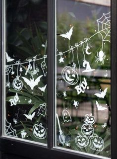 the window is decorated with halloween decorations