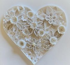 a paper heart with flowers on it