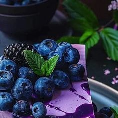 a piece of cake with blueberries on it