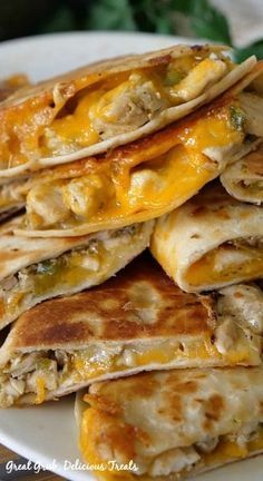 cheesy chicken quesadillas on a white plate with text overlay