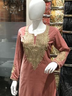 Style up with this elegant velvet kurta with Kashmiri Tilla embroidery. Pair this Tunic Top Kurta with a skirt, trousers, jeans, jeggings, dhoti or any other bottom and be ready in style.- - - - - - - - - - - - - - - - - - - - Product DetailsVelvet Kurta with Kashmiri Tilla Embroidery (Metallic Thread)- Condition: Brand New (Made to Order)- Fabric: Fine Velvet- Fully Lined from Inside- Features Pockets on both sides.- Colour: Peach- Length: 40" (102 cms approx, the mannequin is 6ft tall).- Care Kashmiri Kurta, Kashmiri Tilla Embroidery, Embroidery Metallic, Tilla Embroidery, Traditional Kurta, Skirt Trousers, Velvet Kurta, Kurta Women, Bohemian Tunics