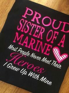 a black t - shirt with pink writing on it that says proud sister of a marine